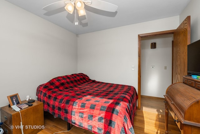 bedroom featuring ceiling fan and wood finished floors