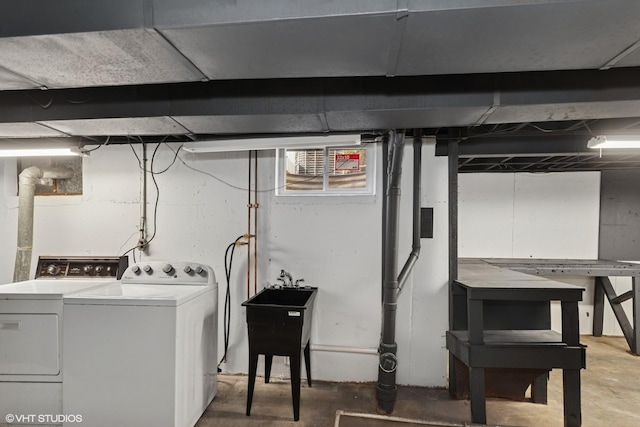 washroom featuring washer and clothes dryer and laundry area