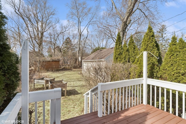 wooden terrace featuring an outbuilding