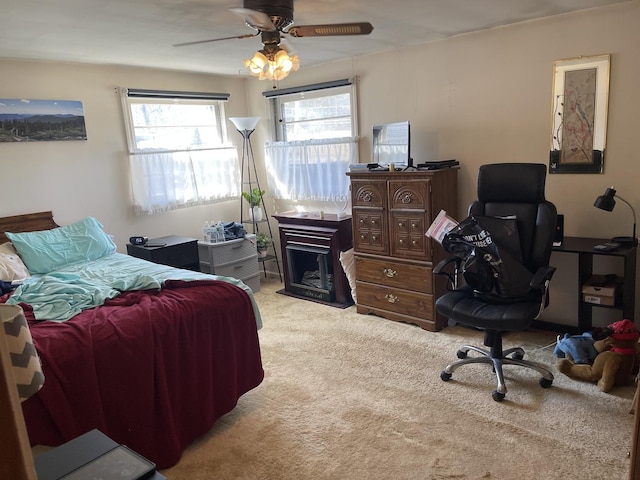 carpeted bedroom featuring ceiling fan