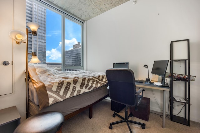 carpeted bedroom with baseboards