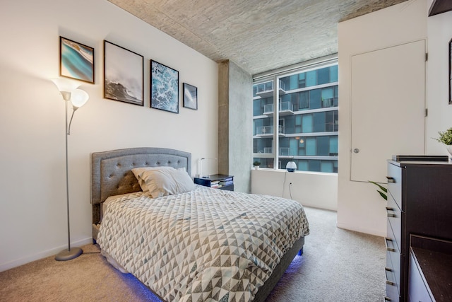 carpeted bedroom with baseboards