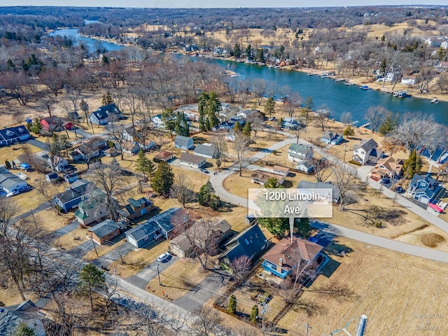 aerial view with a water view and a residential view