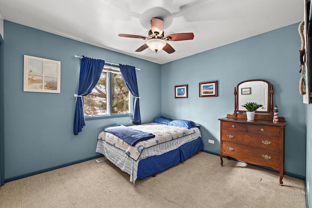 bedroom with baseboards, carpet, and a ceiling fan