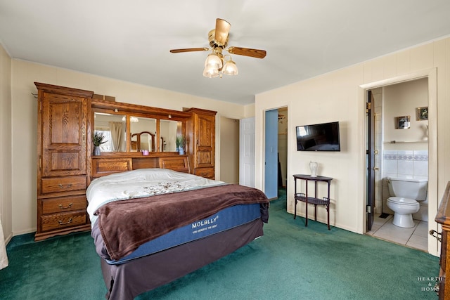 bedroom featuring ensuite bathroom, a ceiling fan, and carpet floors