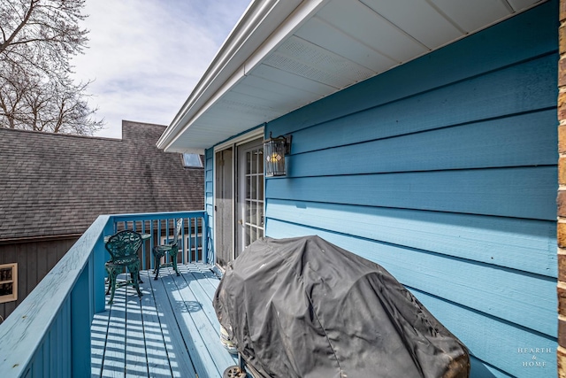 view of wooden balcony featuring a deck and grilling area