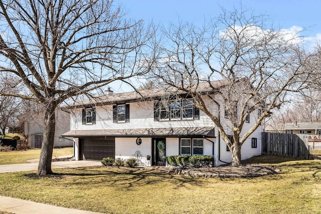 traditional-style house featuring brick siding, driveway, a front yard, and fence