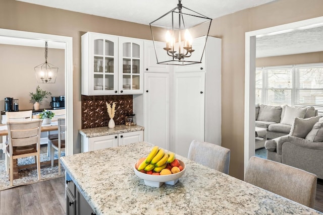 dining room featuring light wood-style flooring and a chandelier