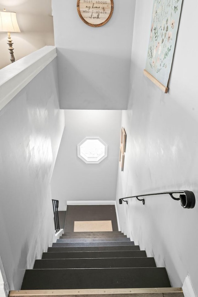 stairway featuring wood finished floors