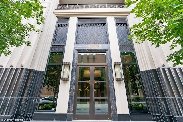 property entrance with french doors and a balcony