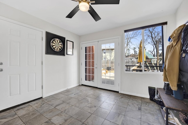 entryway featuring ceiling fan, french doors, and baseboards