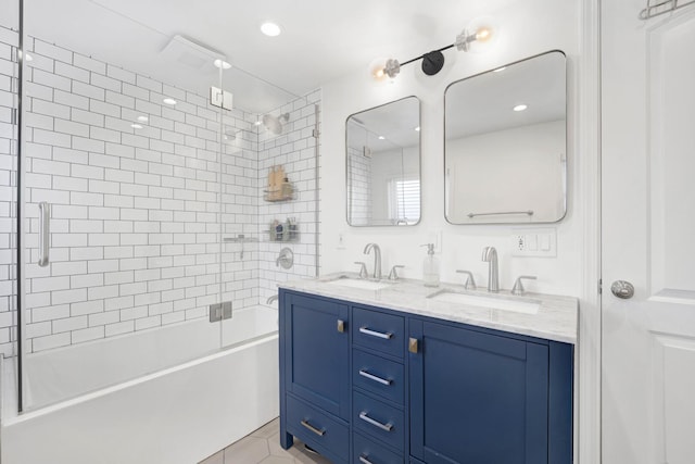 bathroom featuring enclosed tub / shower combo, tile patterned flooring, double vanity, and a sink