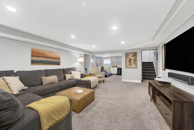 living area with recessed lighting, baseboards, light carpet, and stairs