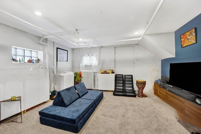 living area with recessed lighting, radiator, and a healthy amount of sunlight