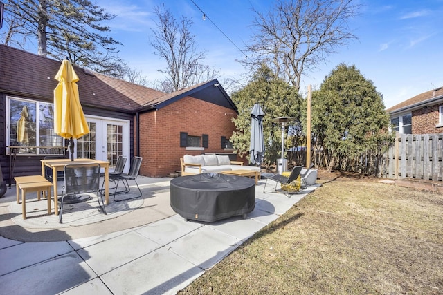 view of patio with french doors, an outdoor hangout area, and fence