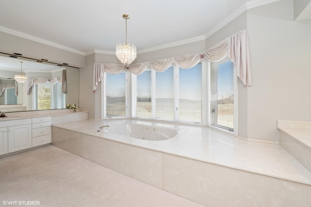 full bath with a jetted tub, vanity, an inviting chandelier, and crown molding