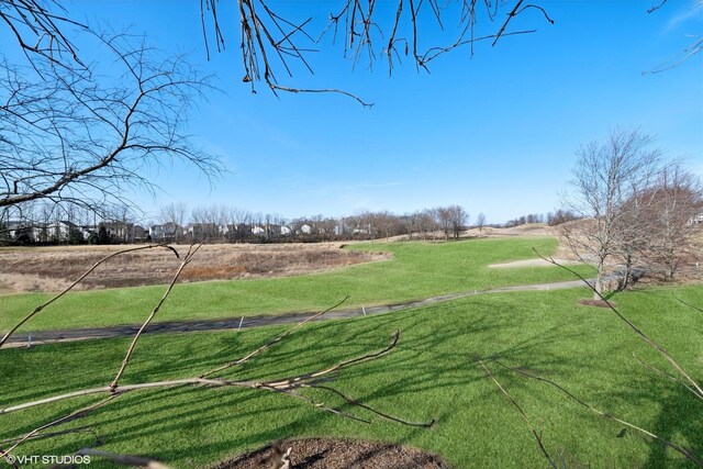 view of yard with a rural view