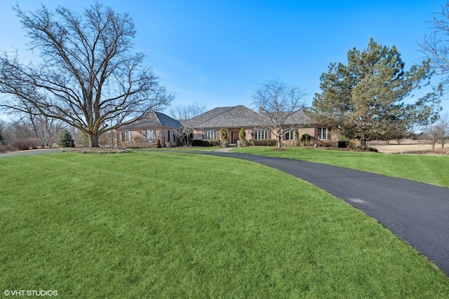 ranch-style house with a front yard