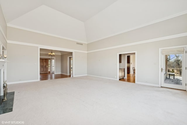 unfurnished living room featuring carpet, baseboards, visible vents, high vaulted ceiling, and a chandelier