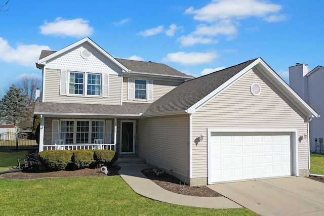 traditional-style home featuring a porch, an attached garage, a shingled roof, concrete driveway, and a front lawn