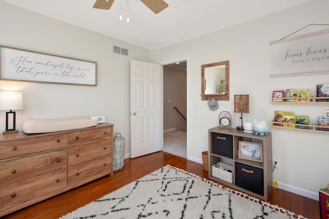 interior space with visible vents, baseboards, and wood finished floors