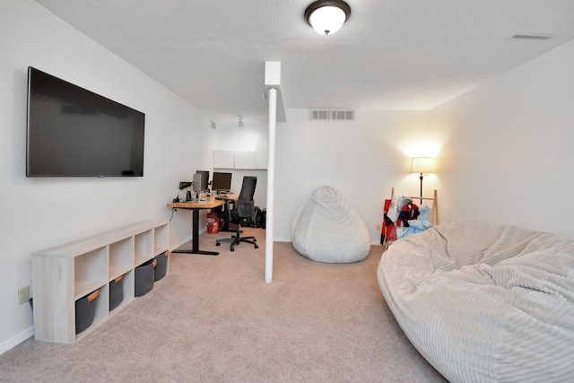 office area with baseboards, visible vents, and carpet floors