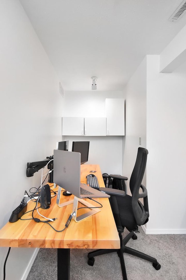 office with baseboards, visible vents, and carpet floors