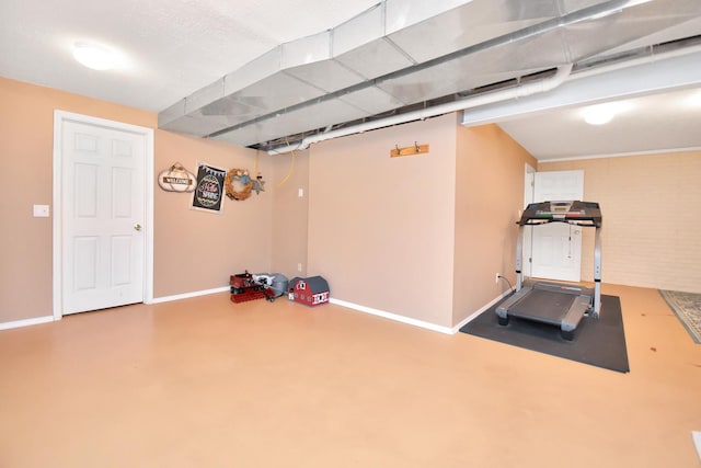 exercise room with baseboards