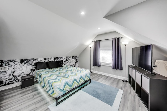 bedroom featuring lofted ceiling, recessed lighting, baseboards, and light wood-type flooring