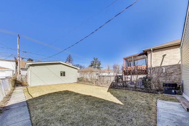 view of yard with an outbuilding and fence