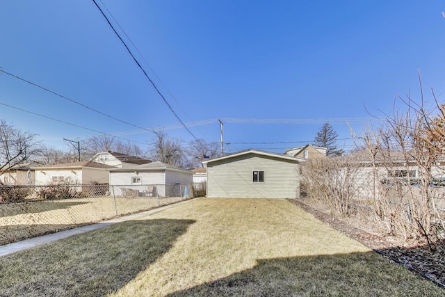 view of yard featuring an outbuilding and fence