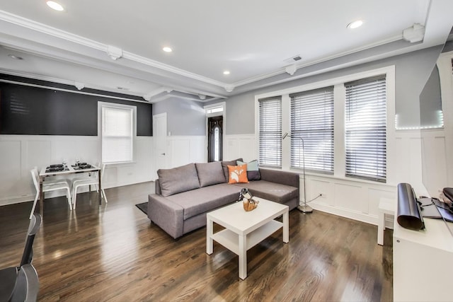 living area featuring recessed lighting, visible vents, wood finished floors, and wainscoting