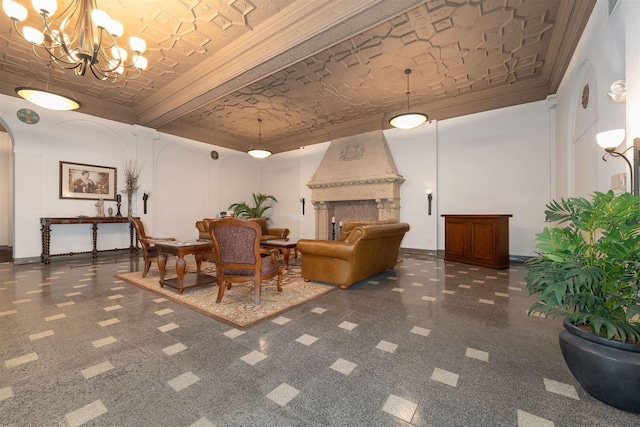 interior space featuring crown molding, baseboards, a chandelier, a fireplace, and arched walkways