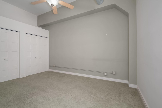 unfurnished bedroom with carpet flooring, baseboards, and ceiling fan