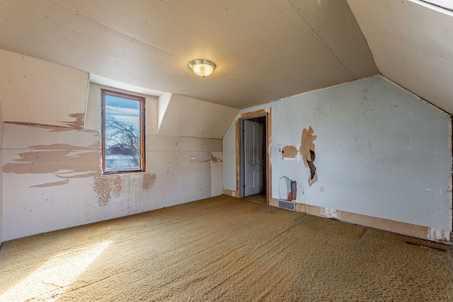 additional living space with vaulted ceiling