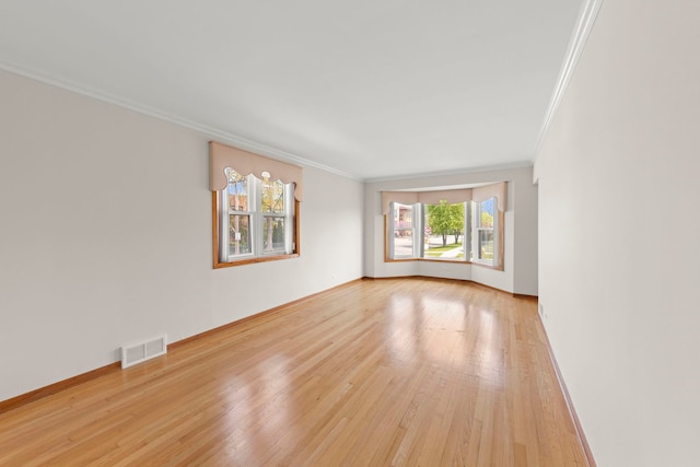 4556 N Newcastle Ave, Harwood Heights, IL 60706 - spare room with crown molding, light wood-type flooring, and baseboards