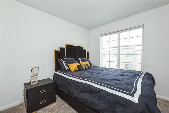 carpeted bedroom with baseboards