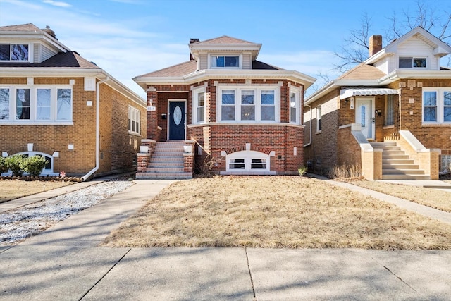 bungalow-style home with brick siding