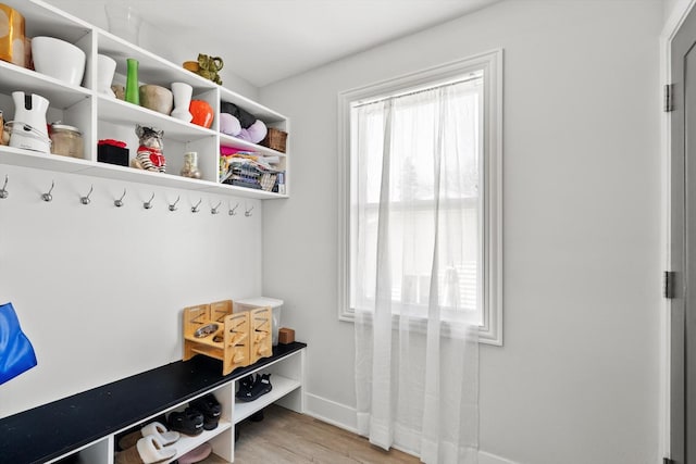 mudroom with light wood-style floors and baseboards