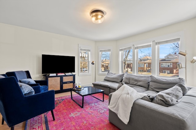 living room featuring baseboards and wood finished floors