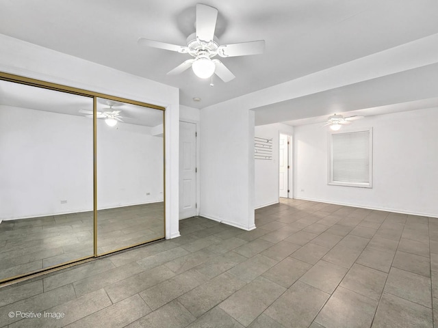 unfurnished bedroom featuring a closet and ceiling fan