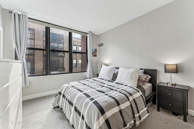 carpeted bedroom with baseboards