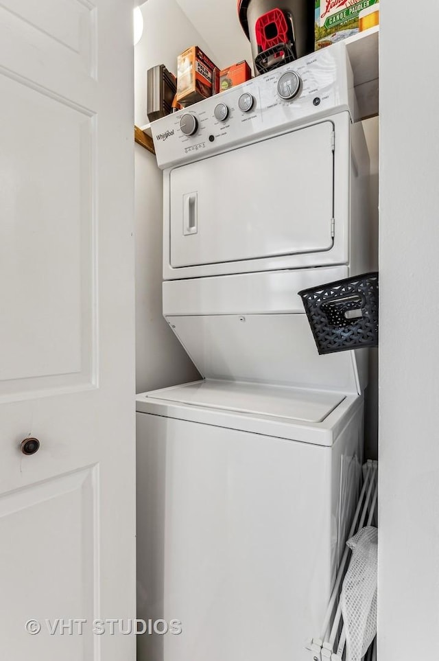 laundry area with stacked washer and clothes dryer and laundry area