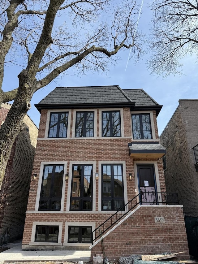 view of front of property featuring brick siding