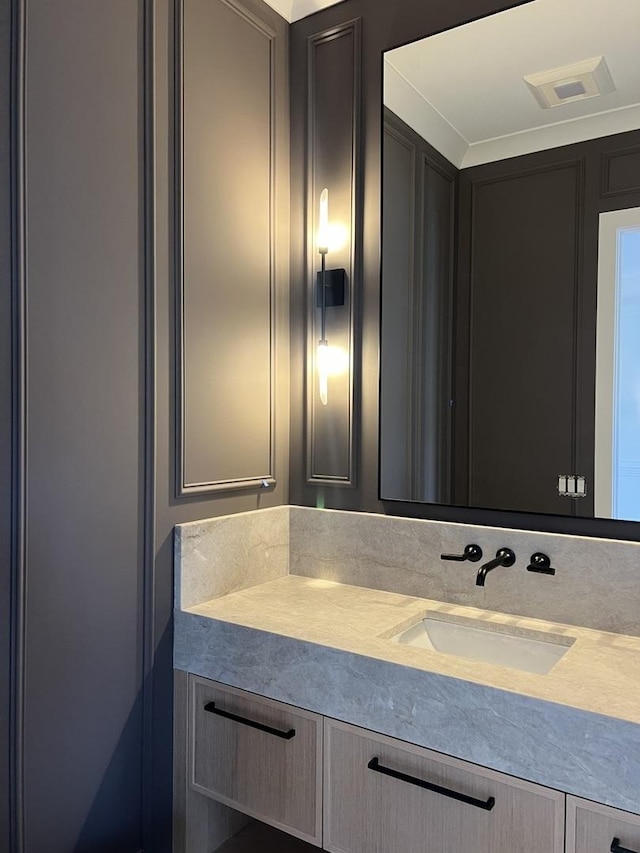 bathroom with visible vents and vanity