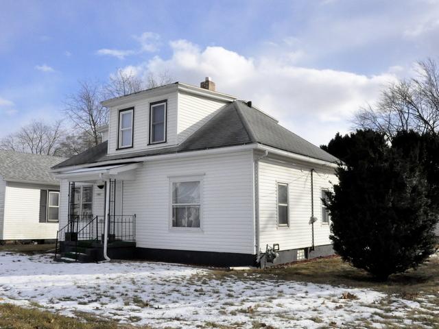 view of front of home featuring a chimney