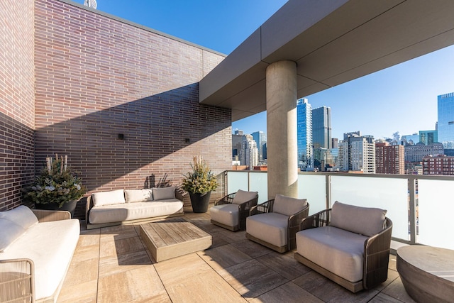 view of patio / terrace with an outdoor living space and a view of city