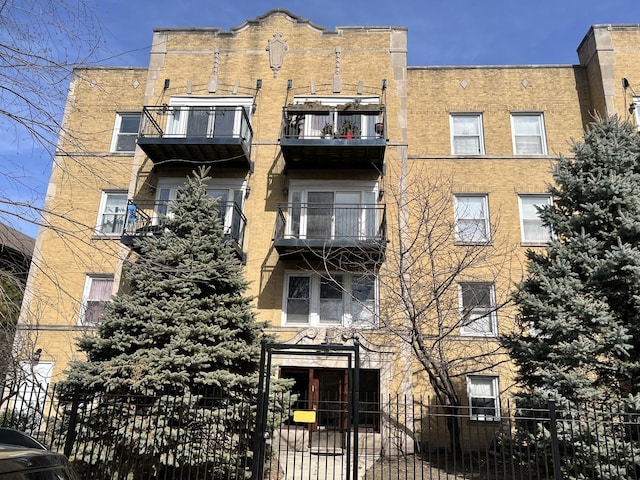 view of building exterior with fence