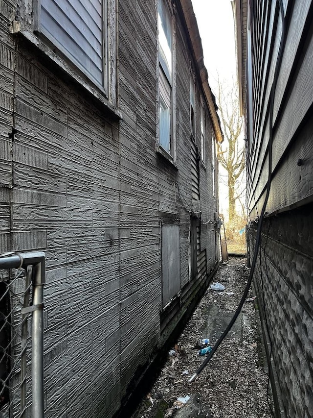 view of property exterior featuring brick siding