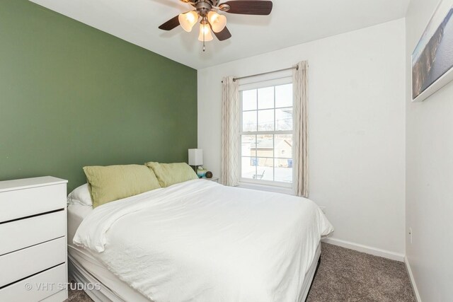 bedroom with baseboards, a ceiling fan, and carpet flooring